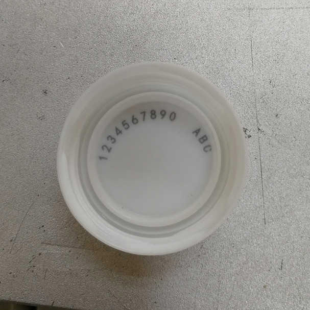 Compact high repetition rate nanosecond lasers marking plastic caps