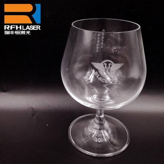 Glass engraving with a rotary ultraviolet (UV) laser engraving system