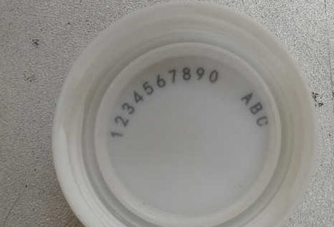 Compact high repetition rate nanosecond lasers  marking plastic caps