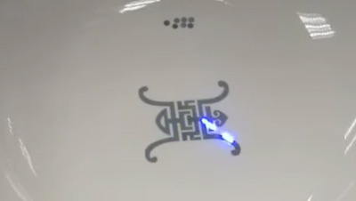RFH 5W Nanosecond UV laser emitter engraving logo on surface of ceramics